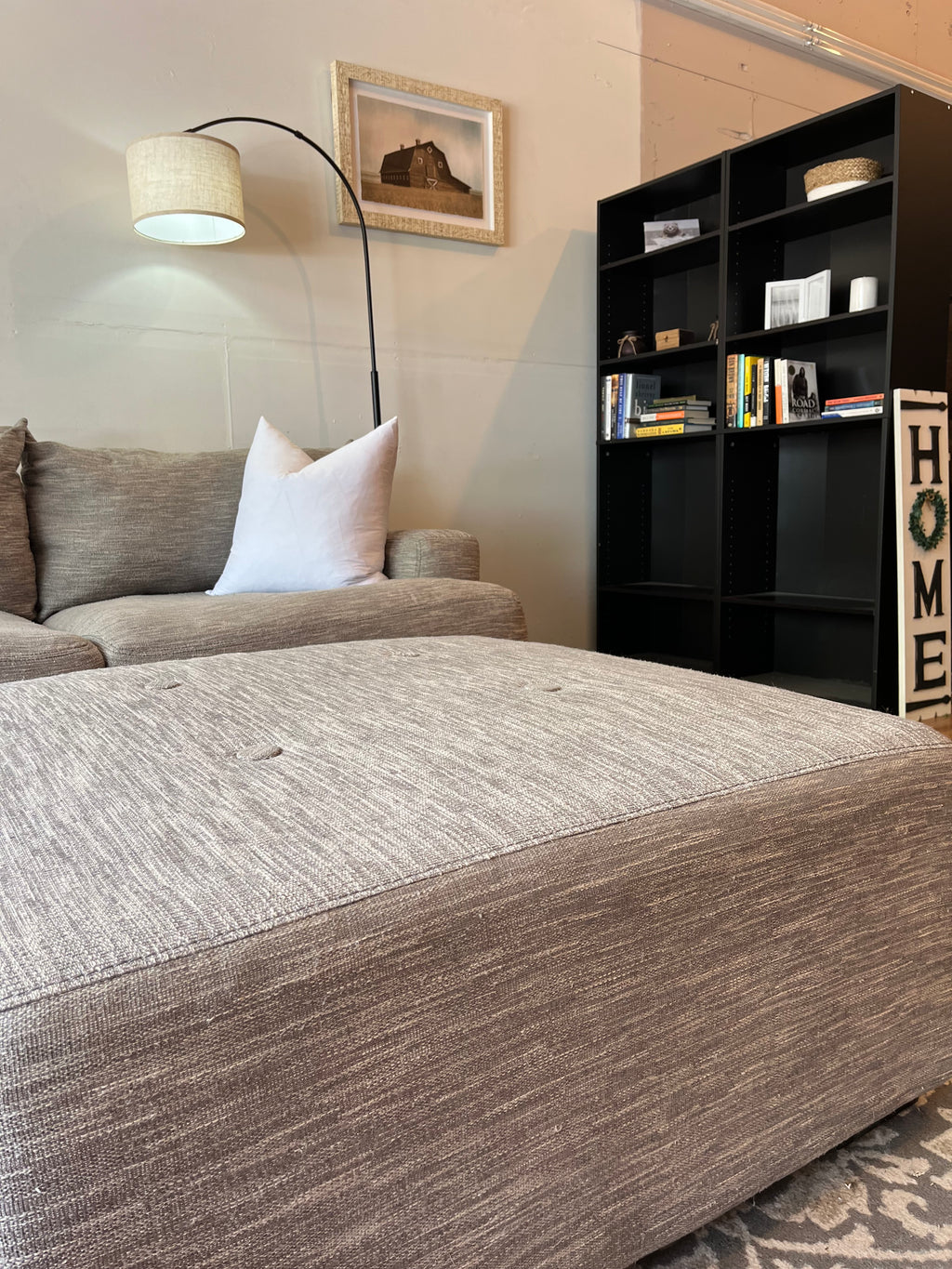 Cardi’s Furniture Sectional and Ottoman in Stone Gray