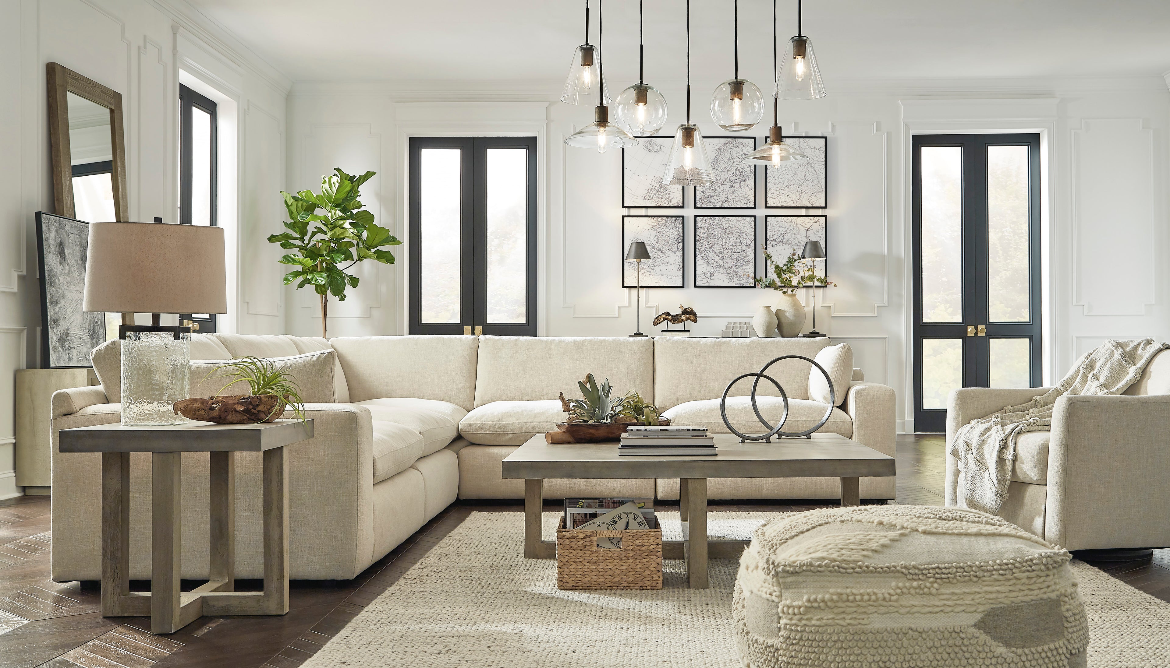 Modern living room with white sectional sofa, wooden coffee table, and decorative elements.